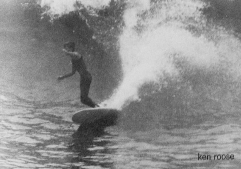 Ken Roose on a big outside day at Penscola Pier, wearing a sleeveless wetsuit. Photo by Skip Savage.